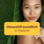Thailändische Frau lehnt sich an ein grünes Blatt an Umweltfreundlich in Thailand