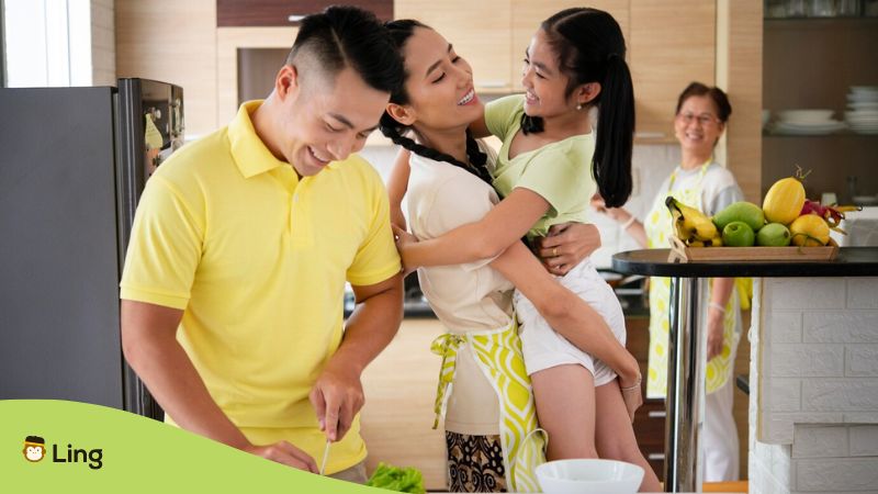 Filipino Vocabulary for family - A photo of happy Filipinos in the kitchen.