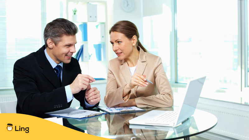 Formal Ways Of Saying Please In Tagalog - A photo of two office person talking.