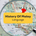 Magnifying glass focusing on map of Malaysia