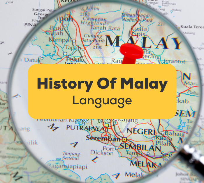Magnifying glass focusing on map of Malaysia
