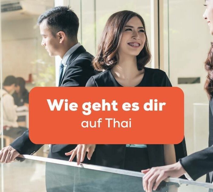 Thailändische Menschen im Büro unterhalten sich und fragen Wie geht es dir auf Thai
