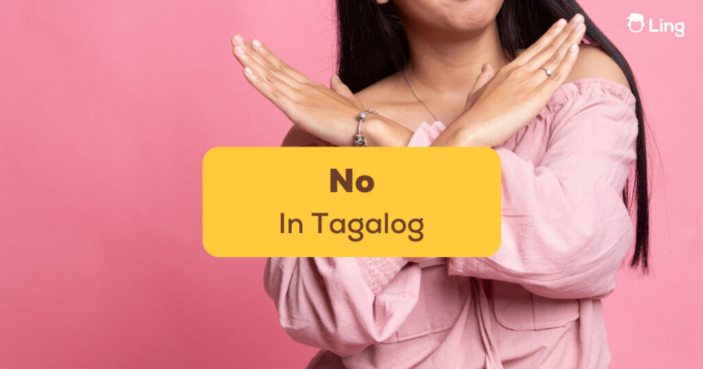 No In Tagalog - A photo of a woman crossing her arms.