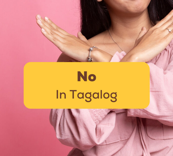 No In Tagalog - A photo of a woman crossing her arms.