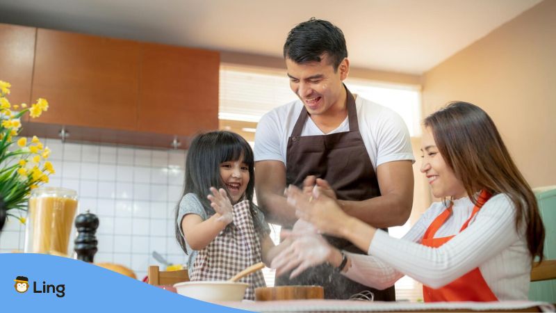 Tagalog cooking utensils - A photo of a family playing with flour