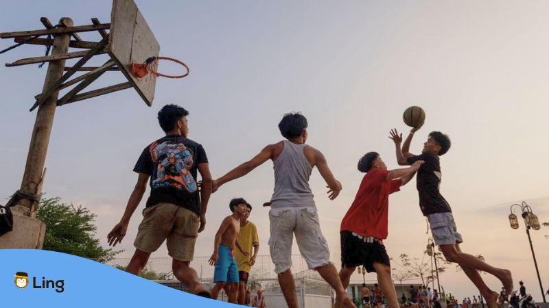 Tagalog sports - A photo of young Filipinos playing basketball on the streets.