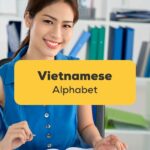 Viet Woman at a desk learning to write the Vietnamese Alphabet with Ling app