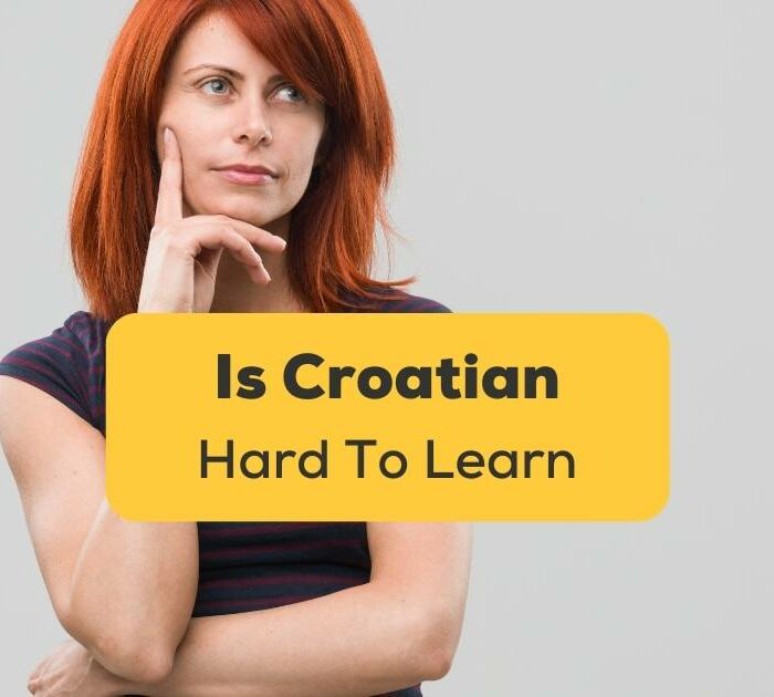 Woman rests her head in one hand and asks herself is Croatian hard to learn