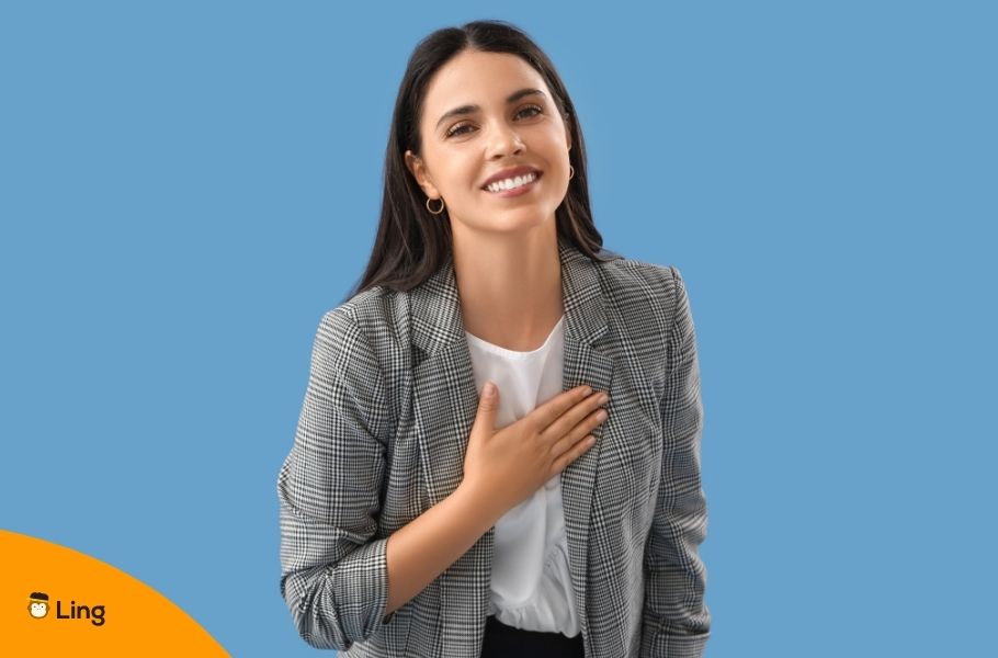A Woman With Her Hand Over Her Heart Showing Gratitude
