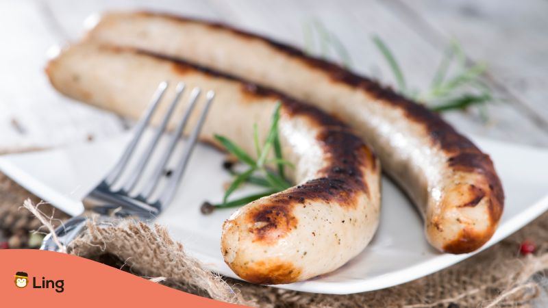 Plate with barbecued German Bratwurst