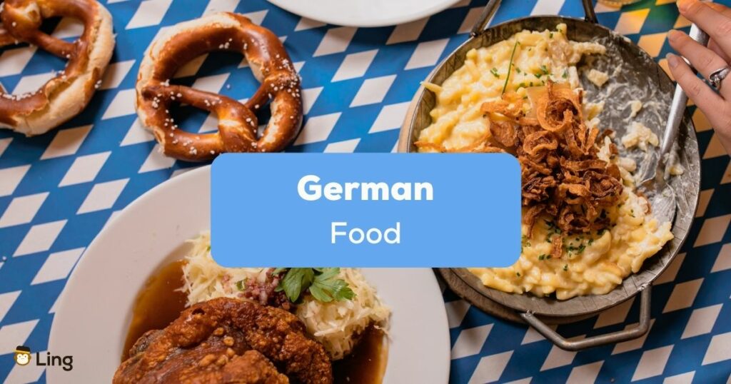 Table with german food like Brezel, Käsespätzle und Braten