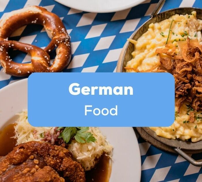 Table with german food like Brezel, Käsespätzle und Braten