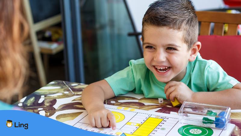 Croatian names for boy smiling while playing with an adult