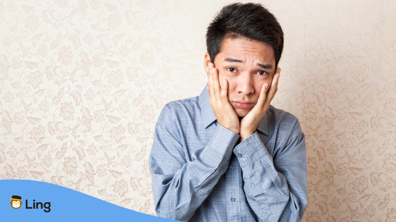 Filipino man looking unhappy thinking about the Don'ts of a relationship