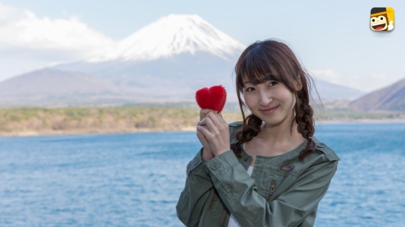 japanese girl with heart with mount fuji in the back say i love you in japanese