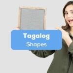 Tagalog shapes - A photo of a woman holding a square object.
