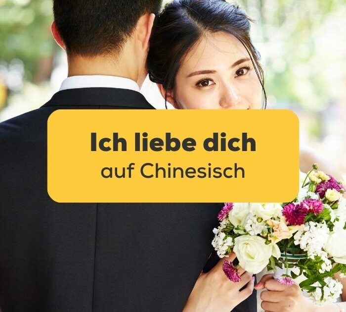 Chinesisches Brautpaat, das Ich liebe dich auf Chinesisch ausdrückt