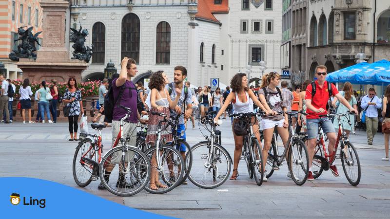 Group with six tourists riding a bicycle through Munich Germany