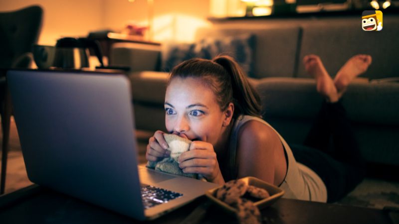 Woman watching serbian movie on a laptop