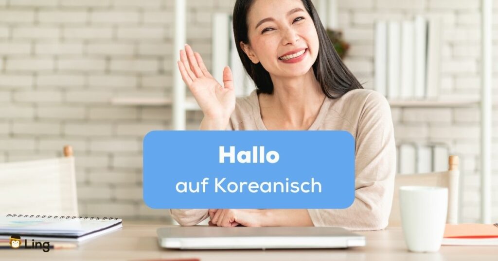Frau winkt um Hallo auf Koreanisch zu sagen