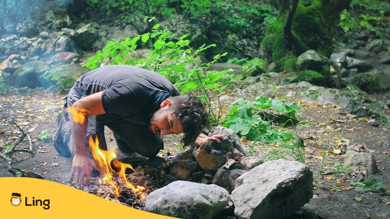 survival phrases in Thai-man in the forest with fire