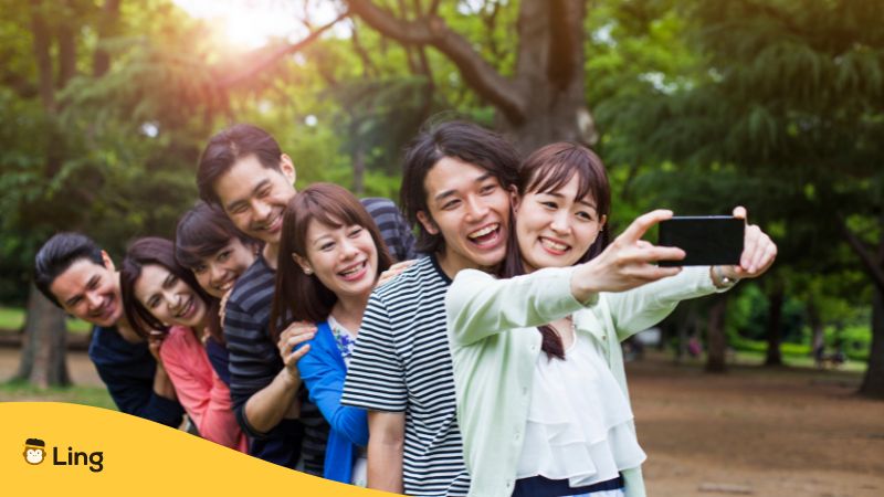 How To Speak Japanese A group of Japanese people taking a selfie