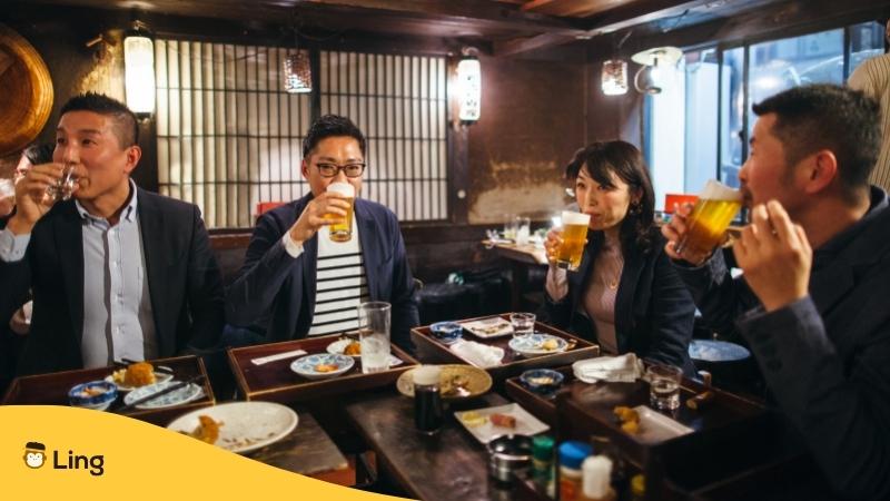 Japanese Group drinking together at a table
