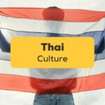 Thai-culture-facts-ling-app-man-showing-thai-flag