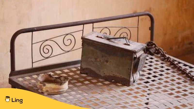 Haunted Places In Cambodia. Metal bed with Metal Box and Bowl at Toul Sleng Genocide Museum.