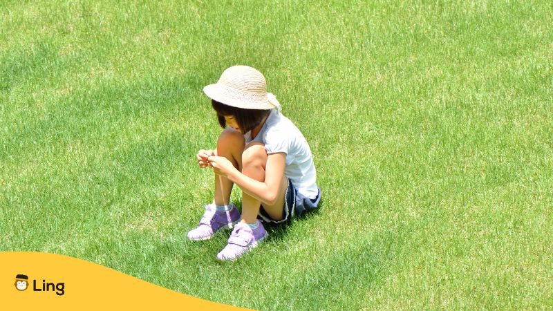 Body Parts In Japanese - little japanese girl sitting on grass
