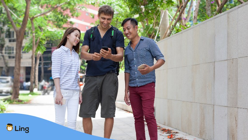 Filipino people helping a foreigner for directions.