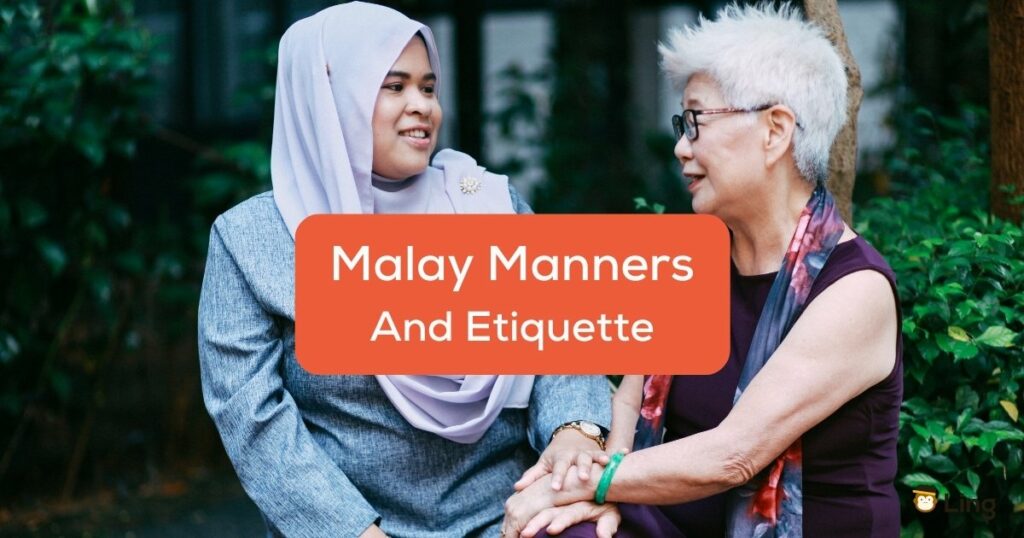 Malaysian woman showing manners and etiquette while talking to an elder.