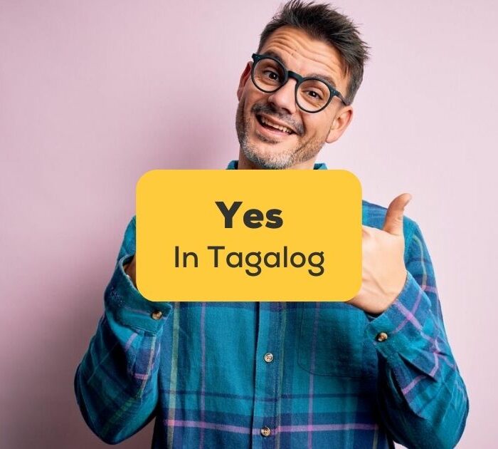yes in Tagalog - A photo of a happy man with glasses