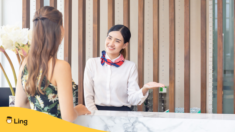 A Filipino Receptionist Saying Hello To Tourist