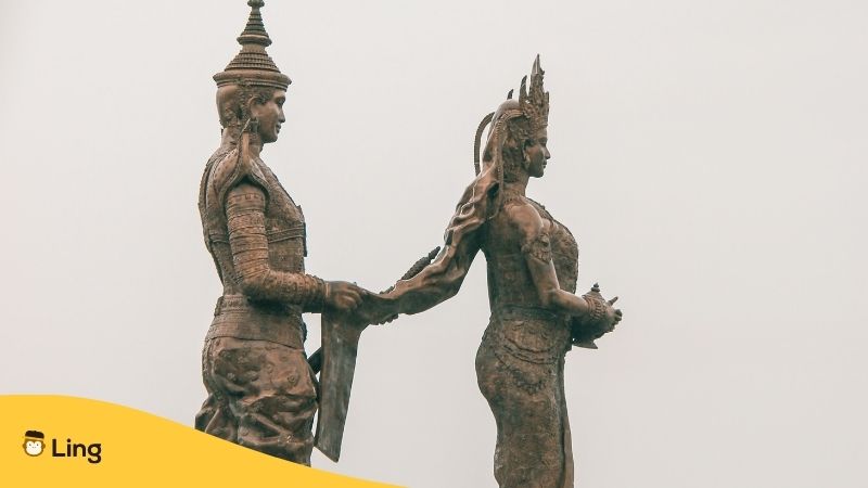 Cambodian Marriage. Statue of Khmer bride and groom with the Cambodian groom holding the bride's veil. 