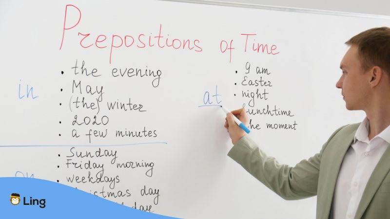 A language teacher discussing prepositions of time.
