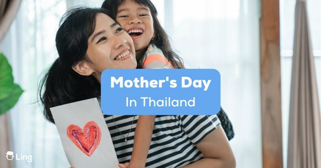 Daughter giving her mom a card for Mother's Day in Thailand.