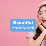 A beautiful woman dressed in a pink princess dress beside the beautiful Malay words text.