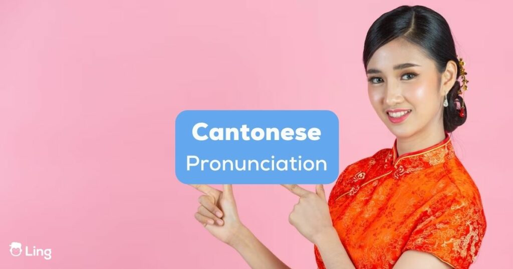 A beautiful Chinese girl pointing to Cantonese pronunciation text.