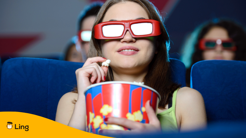 woman watching a movie in the theatre