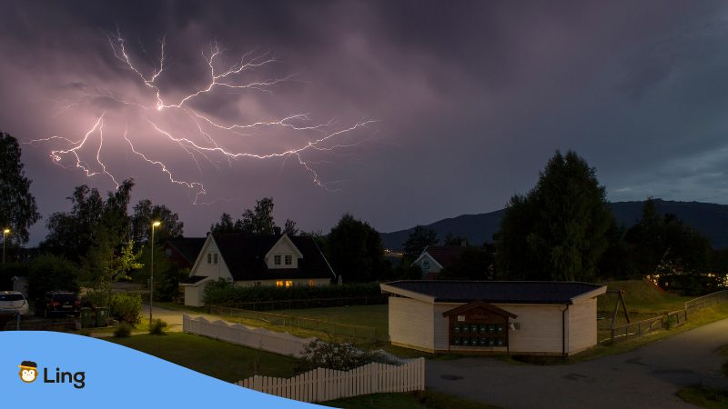 Malay Onomatopoeia - A lightning over a residential area.