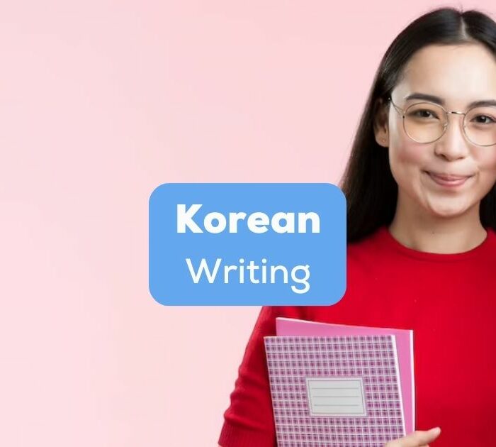 A pretty Asian girl holding notebooks and her glasses beside the Korean writing texts.