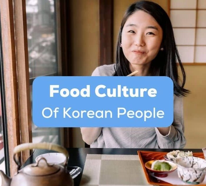 A Korean girl eating inside a small restaurant behind the food culture of Korean people texts.