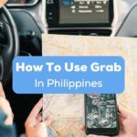 A photo of a driver and a passenger inside a car with a map and mobile phone learning how to use Grab in Philippines.