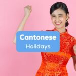 A photo of a pretty Cantonese woman in a red dress looking excited for the upcoming Cantonese holidays.
