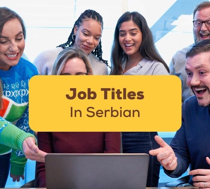 job titles in serbian - co workers together in front of a computer