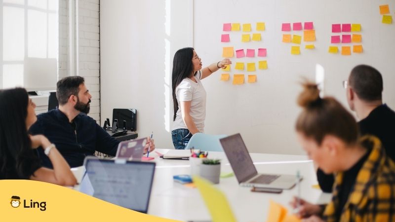 people having a meeting at work - work culture of french people