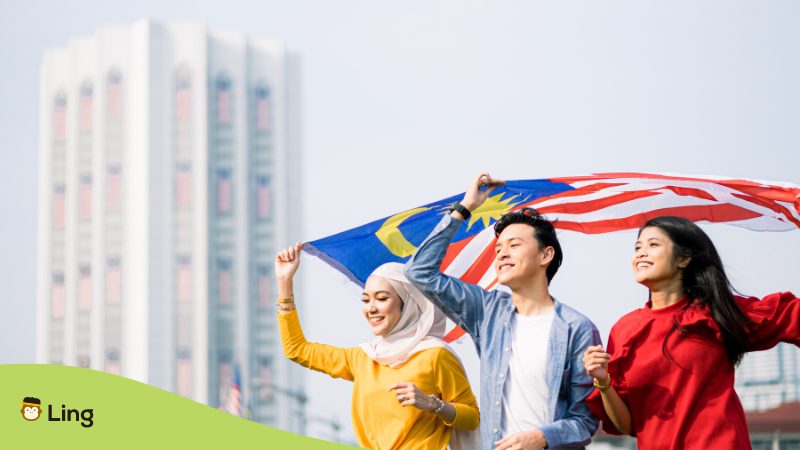 Malaysian people holding Malay flag