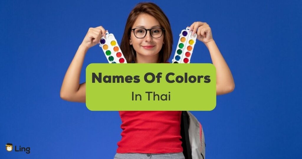 names of colors in Thai - A photo of a woman holding coloring tools