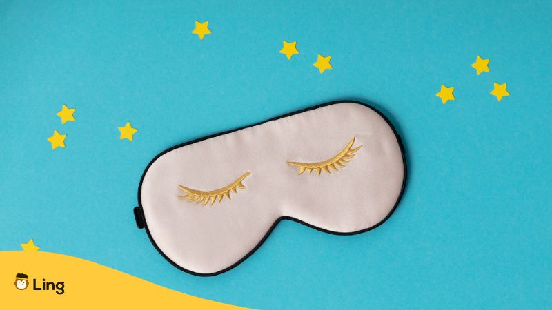 white kawaii sleeping mask with yellow stars in the background